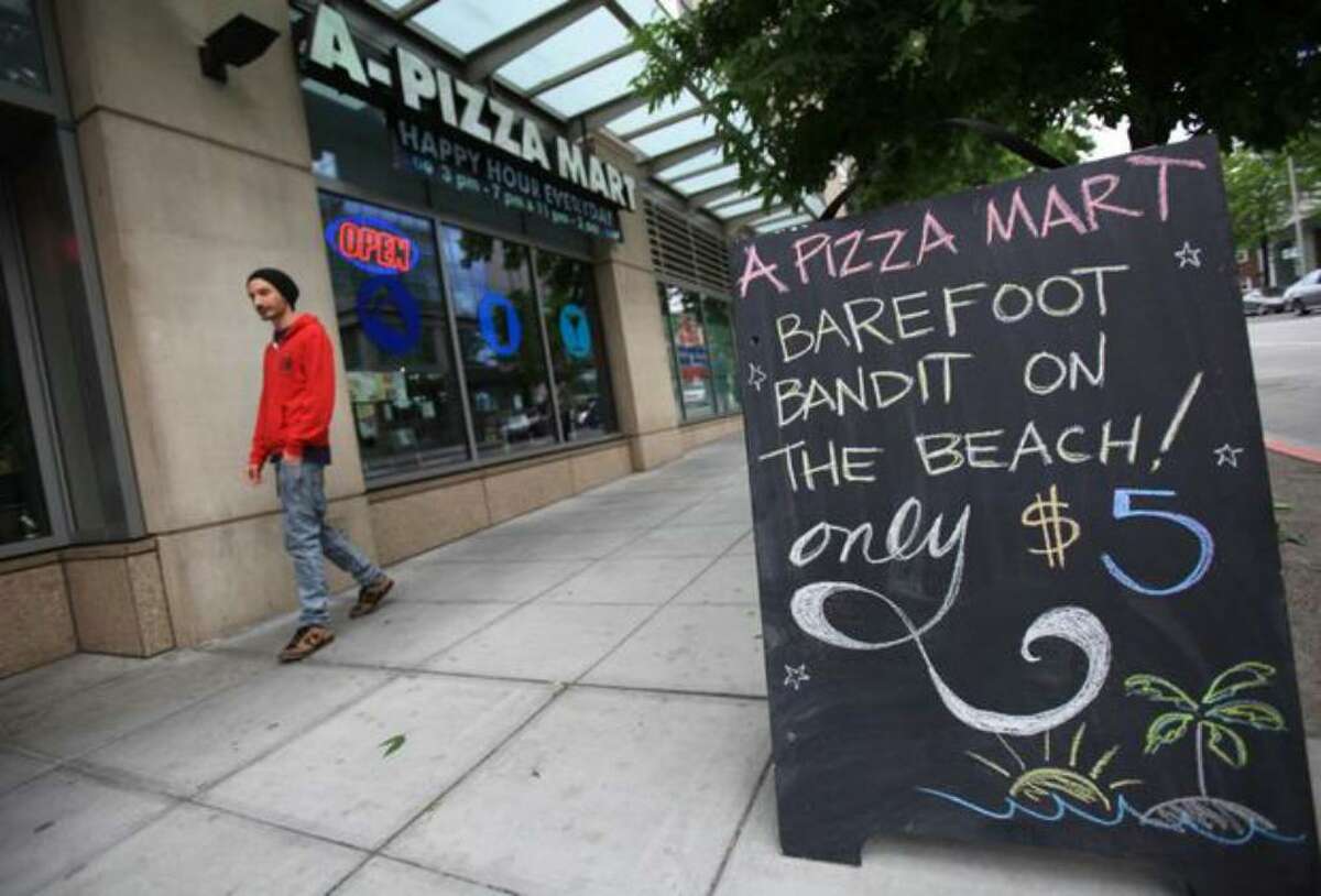 A-Pizza Mart offers a "Barefoot Bandit" cocktail as a hearing for Colton Harris-Moore takes place down the street at the United States Courthouse in Seattle.