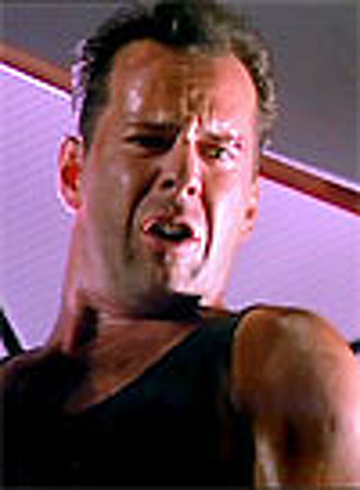 Who can forget the heart pumping, edge of your seat thrill of the original Die Hard? It starred Bruce Willis - who still had hair- as John MCClane, a NYPD cop, who takes on German terrorist Hans Gruber. Gruber and his evil crew had taken McClane's wife Holly Gennaro and several others hostage during a Christmas party at the Nakatomi Plaza in Los Angeles.Willis in "Die Hard"