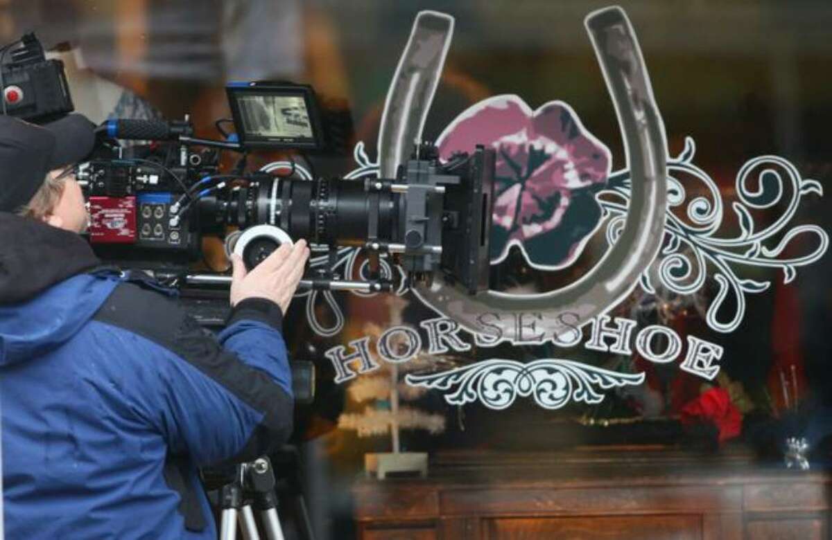 A camera crew shoots a scene during filming of the movie "Late Autumn" along Ballard Avenue Northwest on Jan. 14.