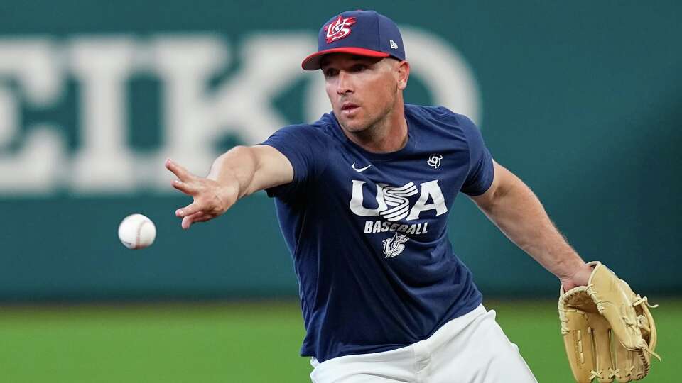 United States third baseman Alex Bregman fields a ground ball during a World Baseball Classic workout Thursday, March 5, 2026, in Houston. (AP Photo/David J. Phillip)