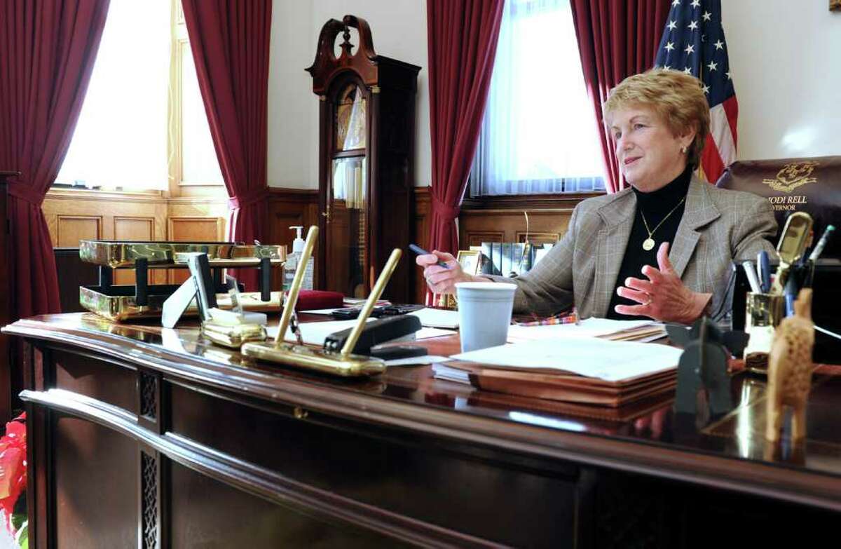 Gov. M. Jodi Rell its at her desk in her office at the Captial in Hartford Tuesday, Dec. 14, 2010.