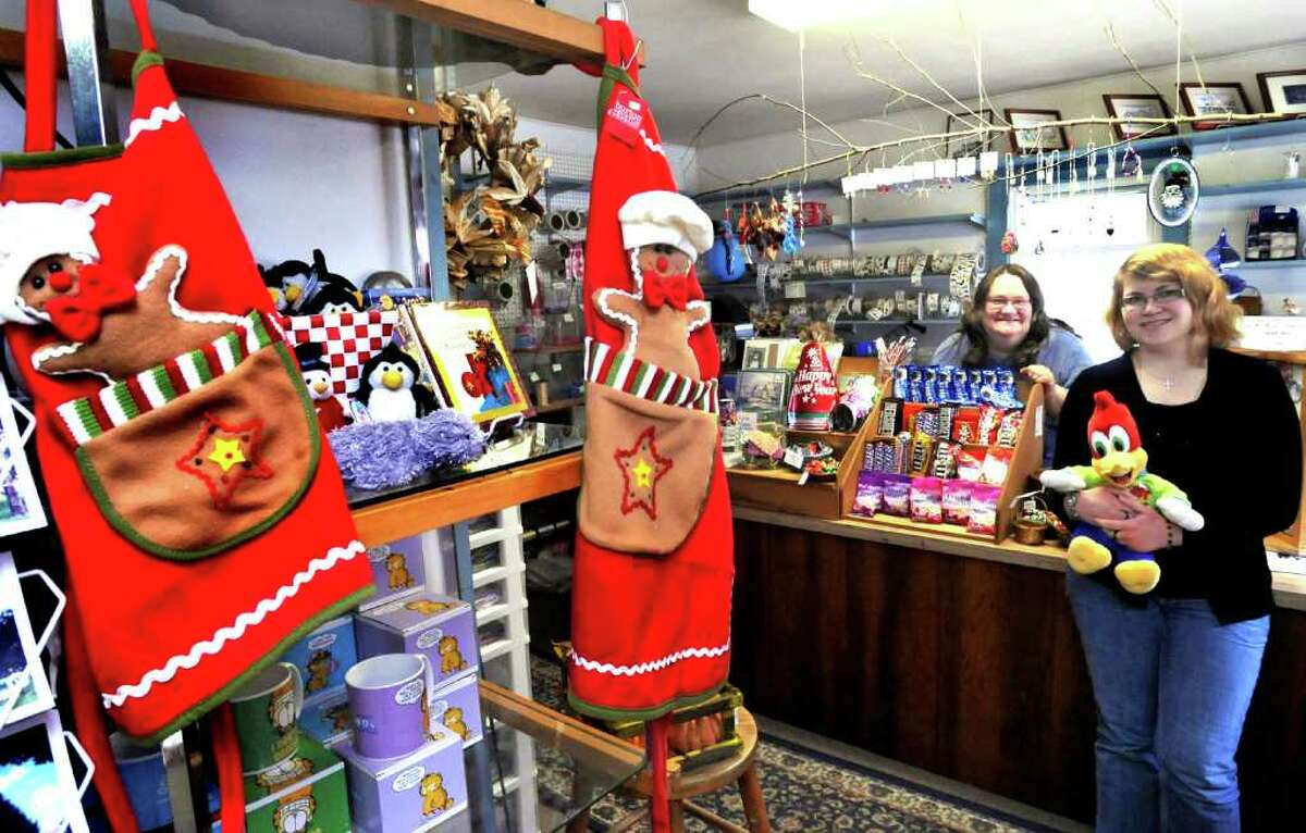 Amy Morrison, new and original owner of The Enchanted Forest, stands with her daughter, Elizabeth, right, in the New Milford shop, Wednesday, Dec. 15, 2010.