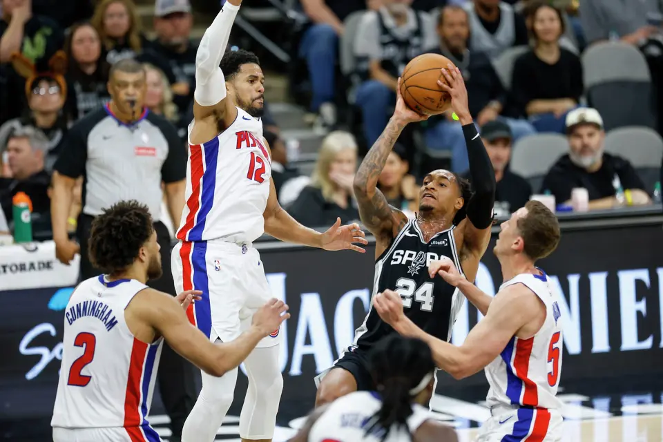 San Antonio Spurs guard Devin Vassell (24) looks to shoot guarded by Detroit Pistons forward Tobias Harris (12) at Frost Bank Center in San Antonio, Thursday, March 5, 2026.