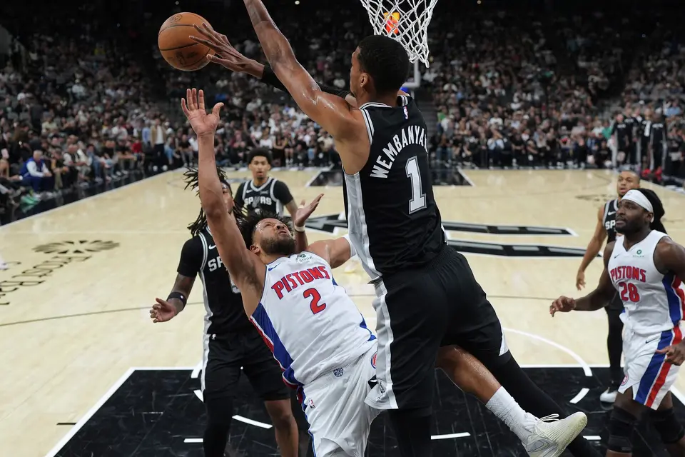 Detroit Pistons guard Cade Cunningham (2) is blocked by San Antonio Spurs forward Victor Wembanyama (1) during the first half of an NBA basketball game in San Antonio, Thursday, March 5, 2026.