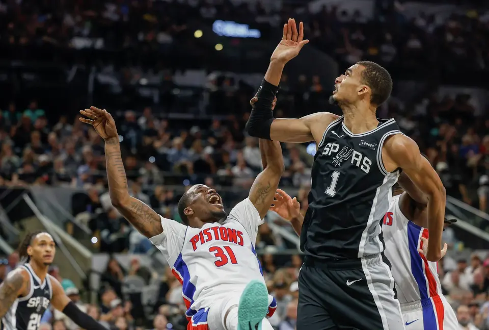 Detroit Pistons guard Javonte Green (31) falls guarded by San Antonio Spurs forward Victor Wembanyama San Antonio Spurs forward Victor Wembanyama (1) at Frost Bank Center in San Antonio, Thursday, March 5, 2026. The Spurs defeated the Pistons, 121-106.
