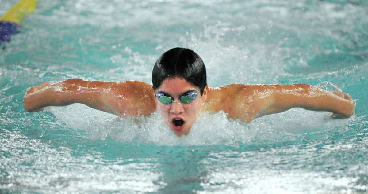 Michael Dustin of Greenwich High School competes in the 100 yard butterfly event during meet against Darien High School at the Darien YMCA, Wednesday afternoon, Dec. 15, 2010.