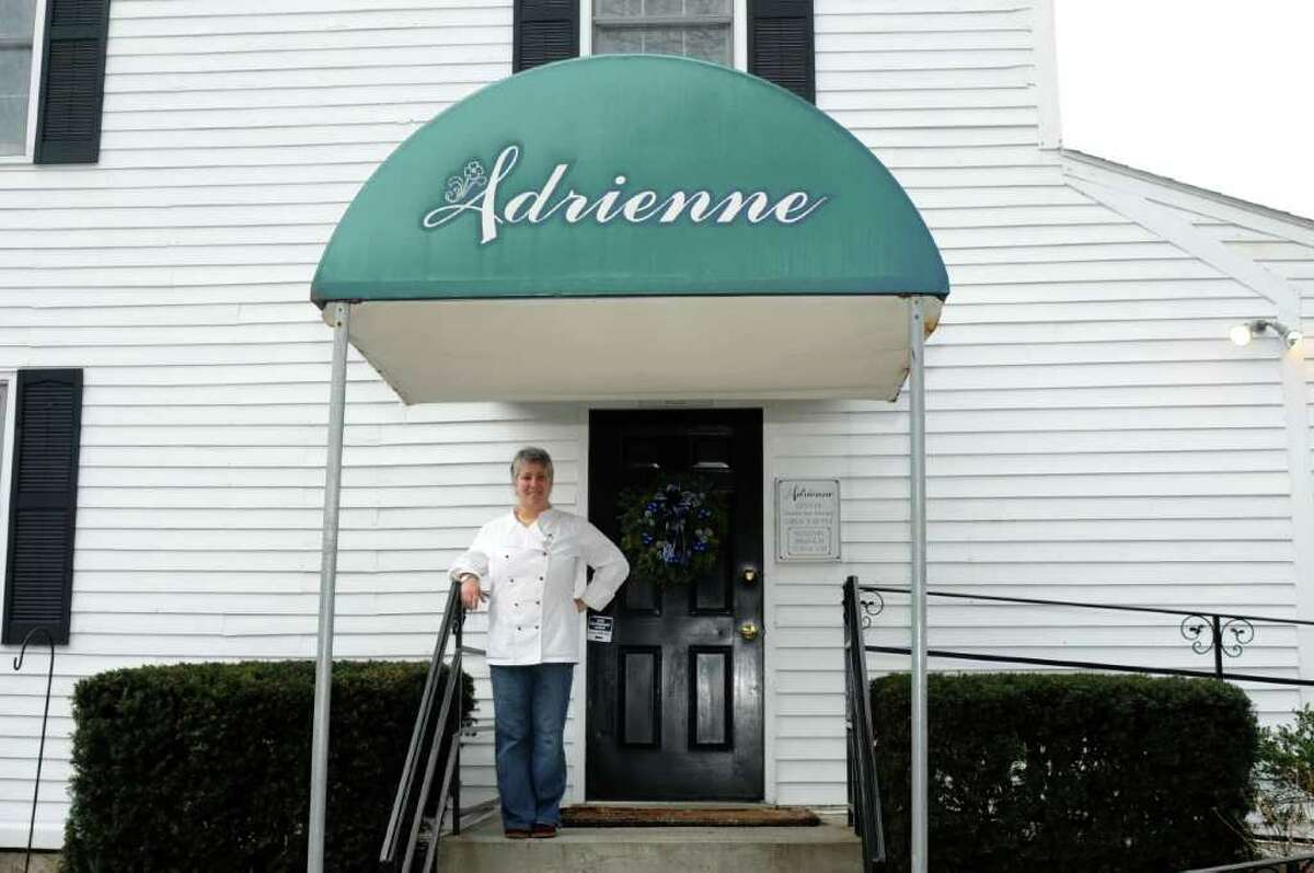 Adrienne Sussman owner and chef of Adrienne Fine American Dining in New Milford, stands at the entrance to her restaurant on Tuesday, Dec. 14, 2010.