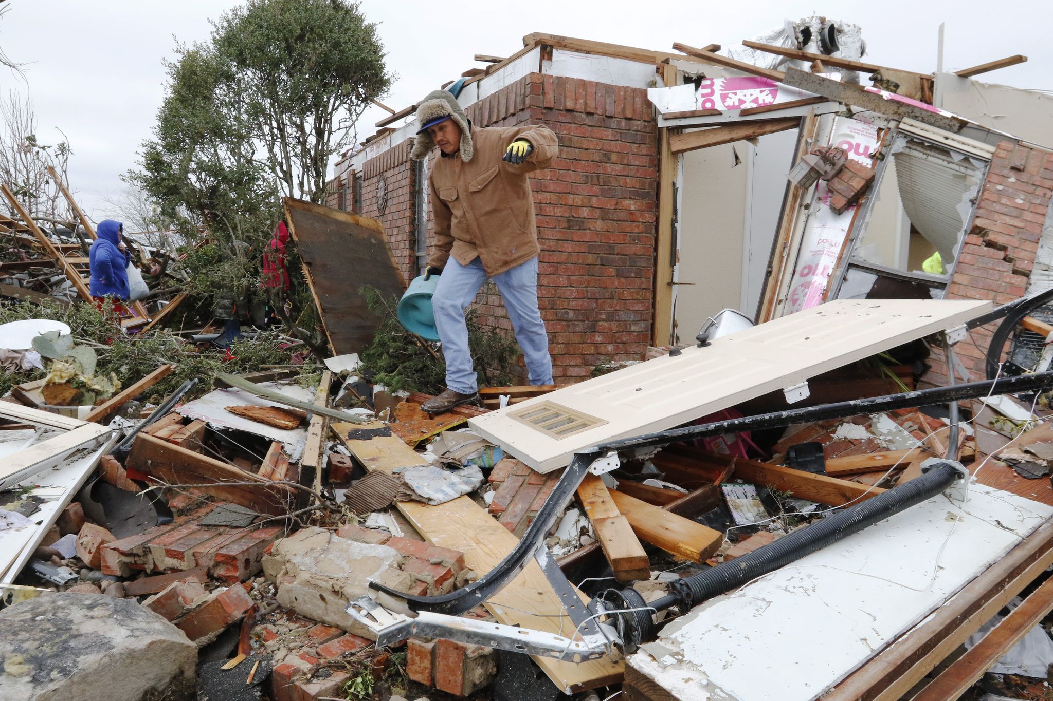 North Texas residents try to pick up the pieces following Dec. 26 tornadoes