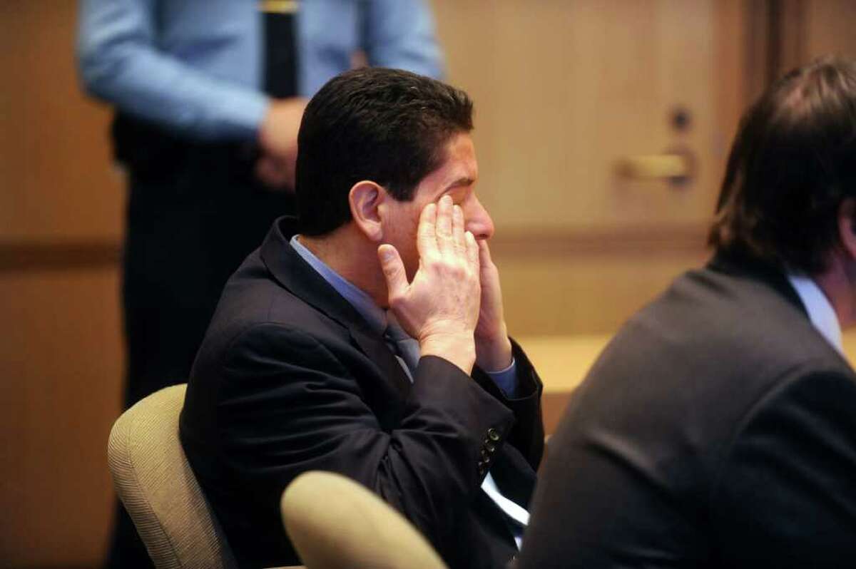 Carlos Trujillo, left, cried when he was acquitted of murder in the slaying of Andrew Kissel, at state Superior Court in Stamford on Thursday, Dec. 16, 2010. Trujillo's attorney Lindy Urso sits with him.