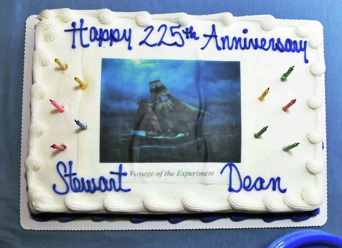 A cake decorated with painter Len Tantillo's image commemorating the voyage of Stewart Dean's sloop "Experiment." (John Carl D'Annibale / Times Union)