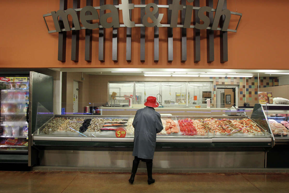 A woman looks over the seafood selection during the remodeling of the Kroger store located at Kirby and Main Wednesday, Dec. 29, 2010, in Houston. (Photo by James Nielsen/Houston Chronicle via Getty Images)