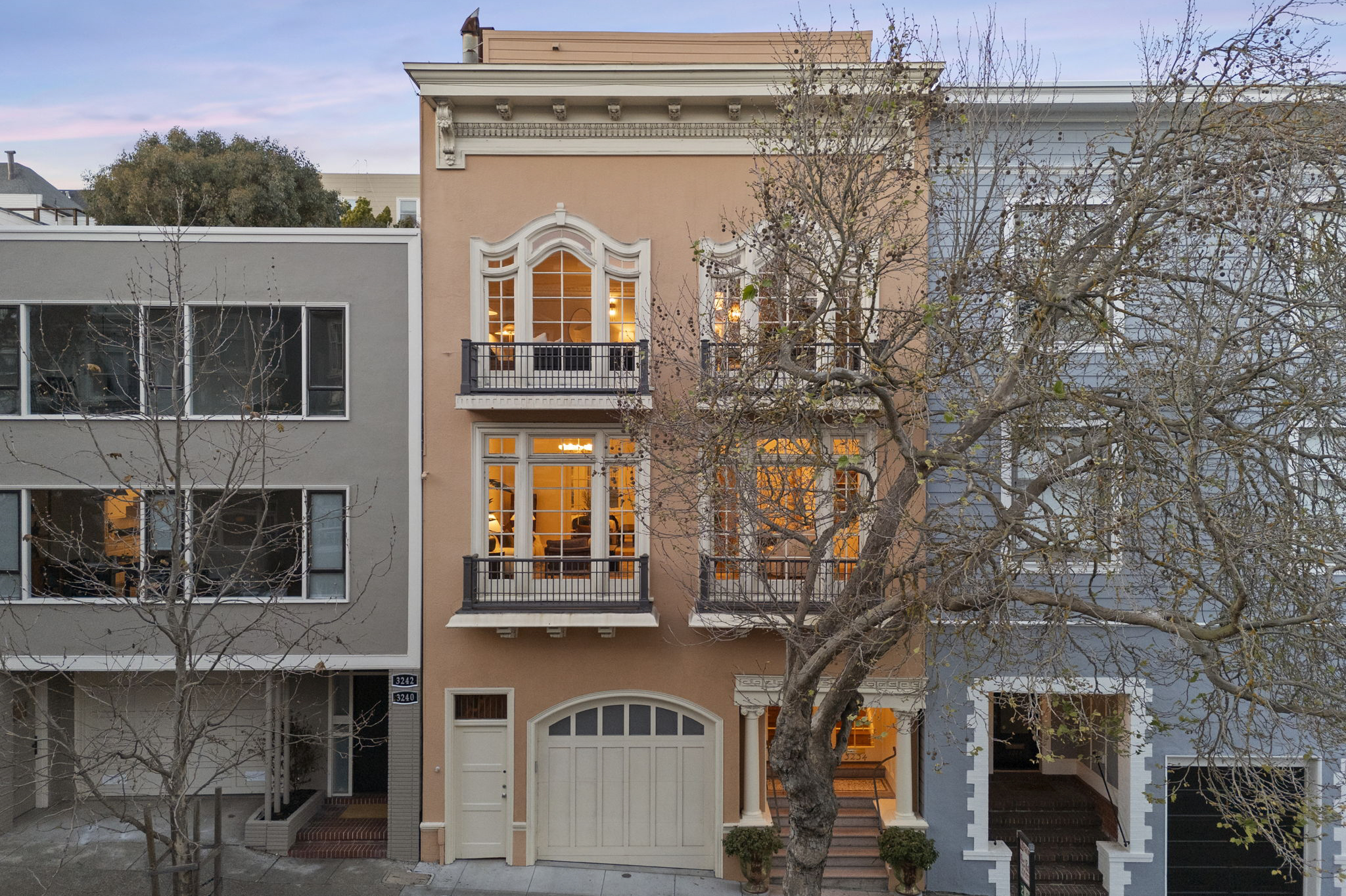 Behind this $4.7M SF duplex, a magical parklike garden awaits