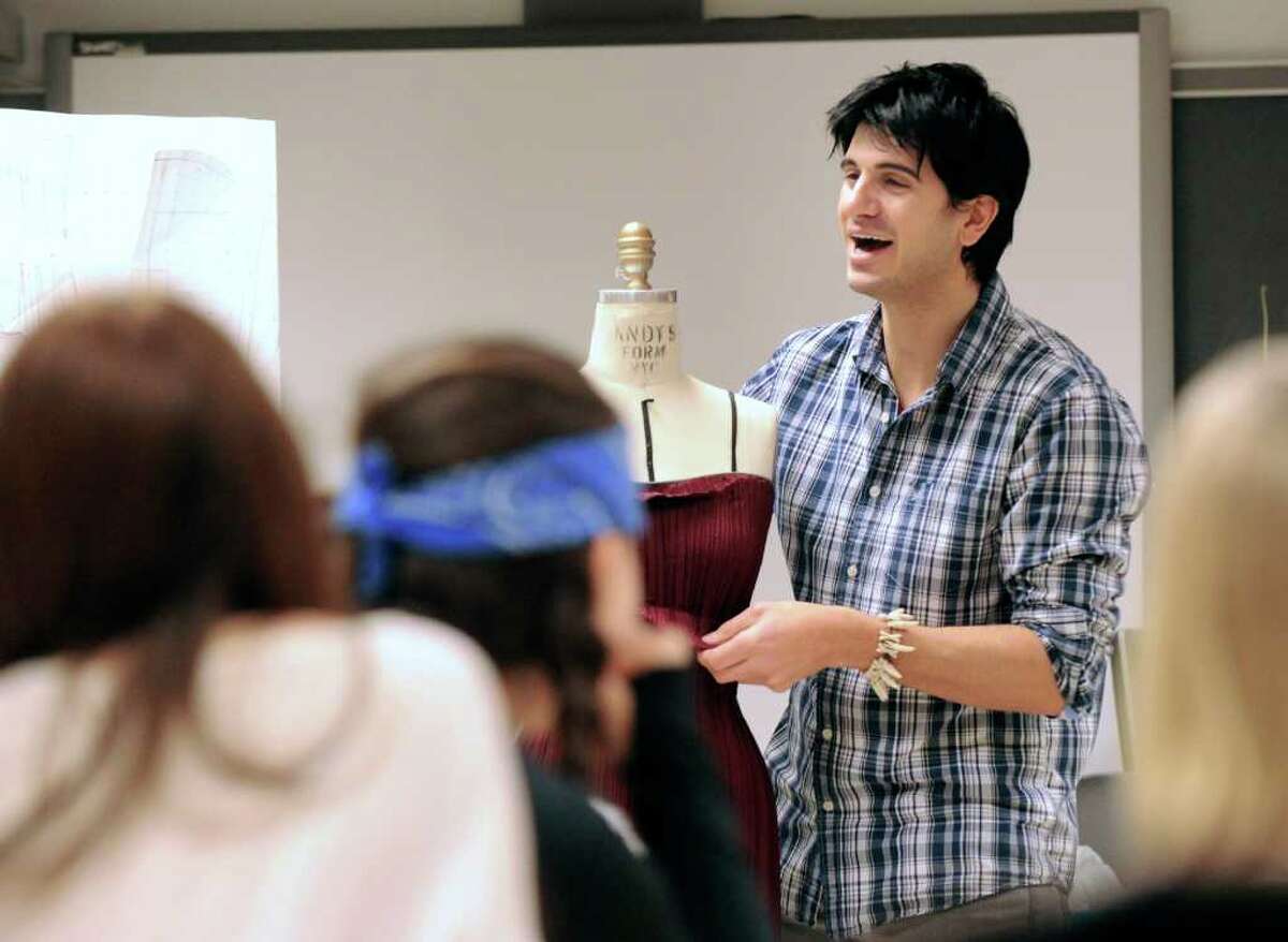 Greenwich fashion designer Jason Troisi, who was on the last season of the popular reality show “Project Runway,” talks about designing dresses during his visit to a Greenwich High School fashion design class, Friday morning, Dec. 17, 2010.
