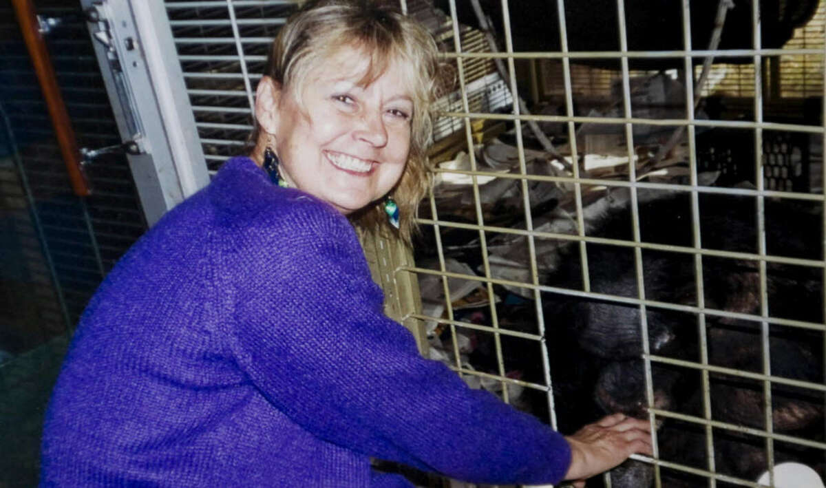 Charla Nash in a 2007 photo next to the cage with the chimpanzee Travis. Nash, who was later mauled by Travis, returned to Stamford Hospital to thank the staff for her recovery.