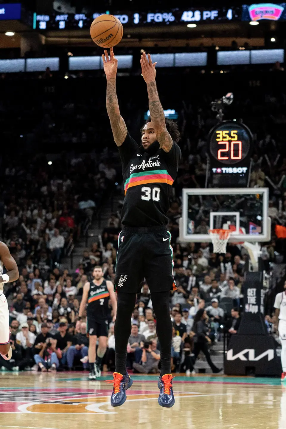 San Antonio Spurs forward Julian Champagnie (30) shoots the ball at Frost Bank Center in San Antonio on Friday, March 6, 2026. The Spurs defeated the Clippers 116-112.