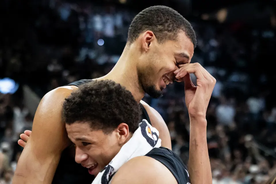 San Antonio Spurs forward Victor Wembanyama (1) is embraced by San Antonio Spurs forward Carter Bryant (11) after the San Antonio Spurs defeated the LA Clippers at Frost Bank Center in San Antonio on Friday, March 6, 2026. The Spurs defeated the Clippers 116-112.