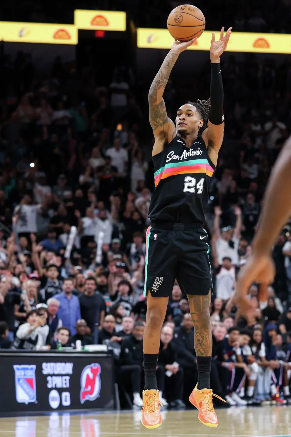San Antonio Spurs guard Devin Vassell (24) makes a three-pointer over the LA Clippers during the fourth quarter at Frost Bank Center in San Antonio, Friday, March 6, 2026. The Spurs defeated the Clippers 116-112.