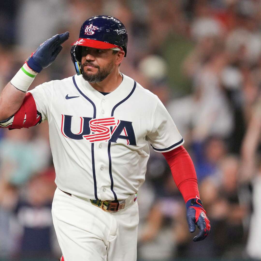 United States designated hitter Kyle Schwarber (12) salutes the dugout after hitting a 2-run home run during the fifth inning of a World Baseball Classic game, Saturday, March 7, 2026, in Houston.
