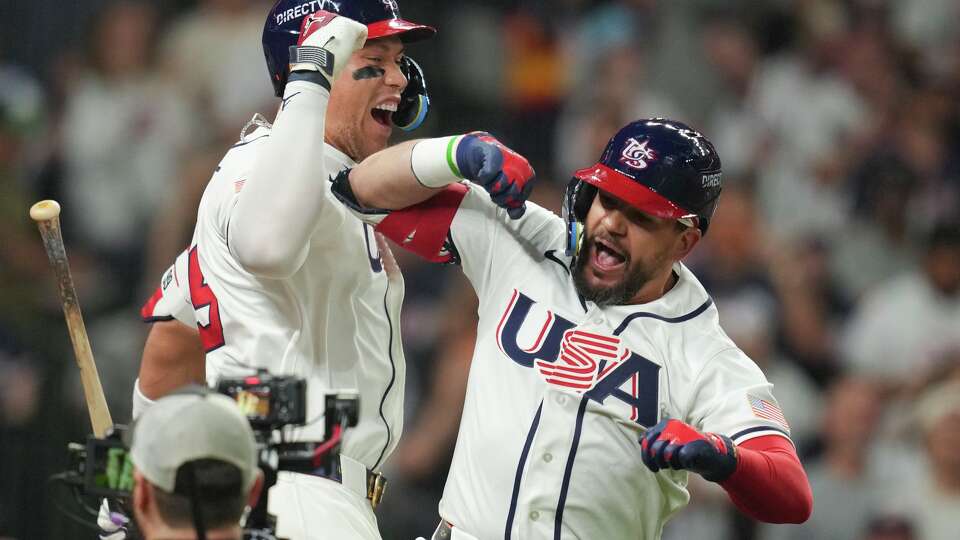 United States designated hitter Kyle Schwarber reacts with Aaron Judge after hitting a 2-run home run during the fifth inning of a World Baseball Classic game, Saturday, March 7, 2026, in Houston.