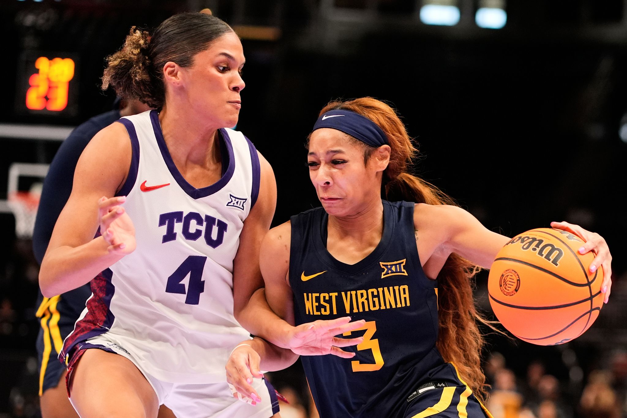 Harrison helps No. 15 West Virginia beat No. 10 TCU 62-53 for the women ...