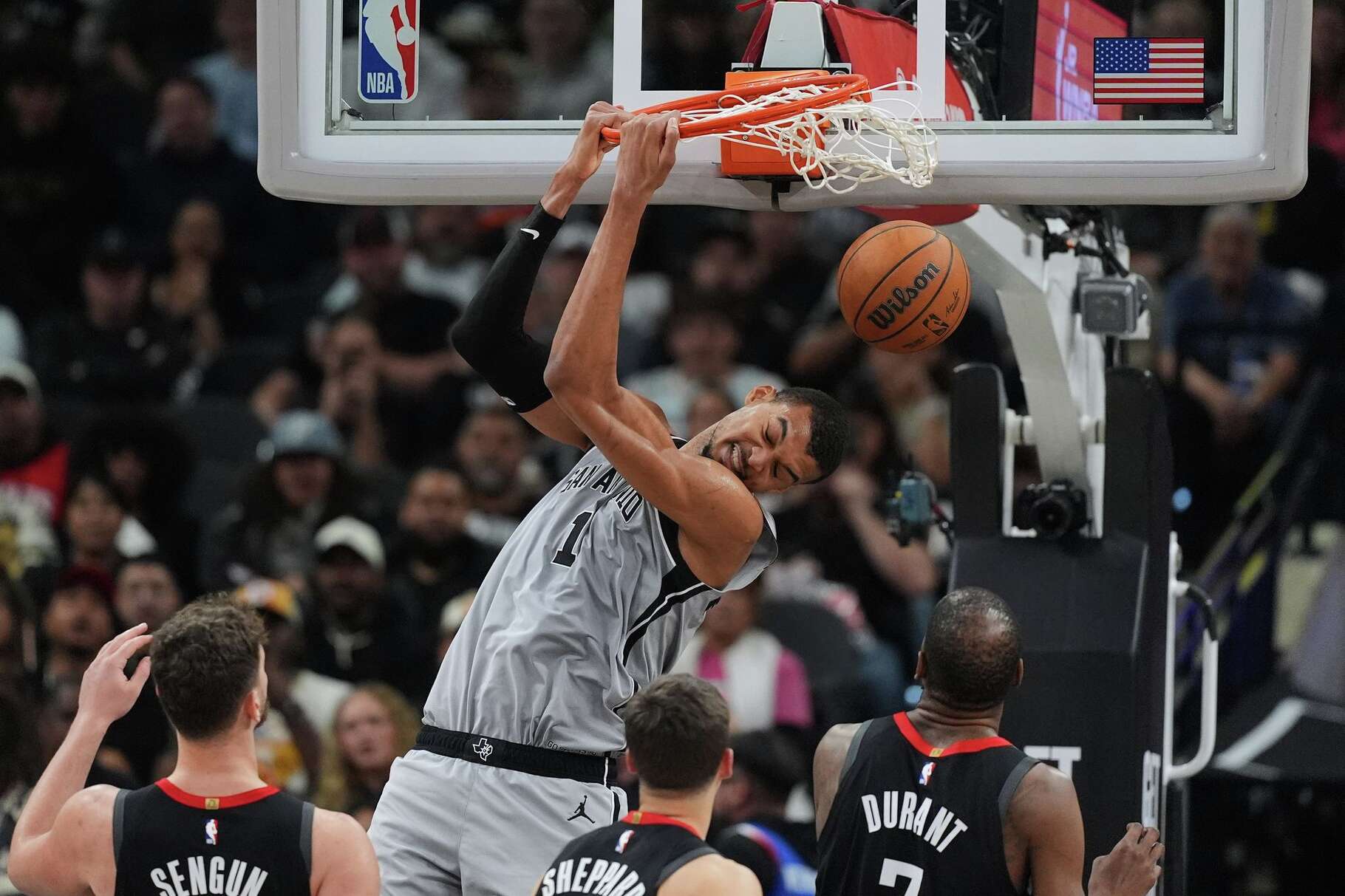 San Antonio Spurs forward Victor Wembanyama (1) dunks over Houston Rockets forward Kevin Durant (7) during the second half of an NBA basketball game in San Antonio, Sunday, March 8, 2026. (AP Photo/Eric Gay)