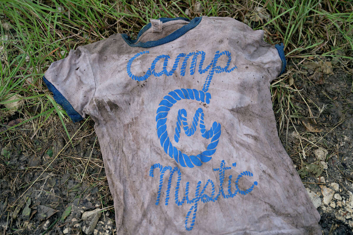 COMFORT, TEXAS - JULY 6: A Camp Mystic T-shirt found by a search and rescue volunteer, photographed in Comfort, Texas on July 6, 2025. The volunteer found the T-shirt yesterday along the Guadalupe River near Ingram, Texas. 'I hope I find the person to return their belongings, not to find closure,' he said. (Photo by Danielle Villasana for The Washington Post via Getty Images)