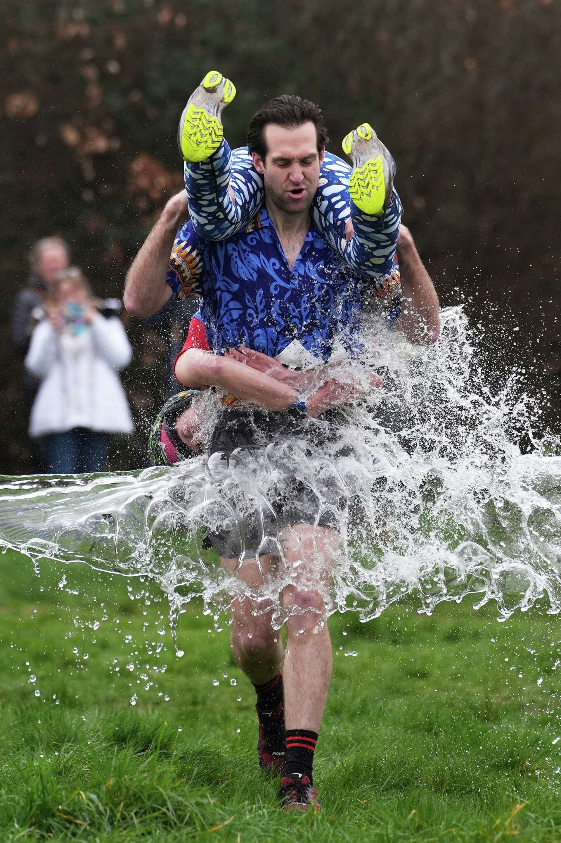 Fullerap Finnish pair wins a barrel of ale in annual 'wife-carrying' contest in ...