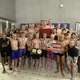 The Pomperaug High boys swim team celebrates its fifth straight Class M title on Tuesday, March 10, 2026 in West Hartford.