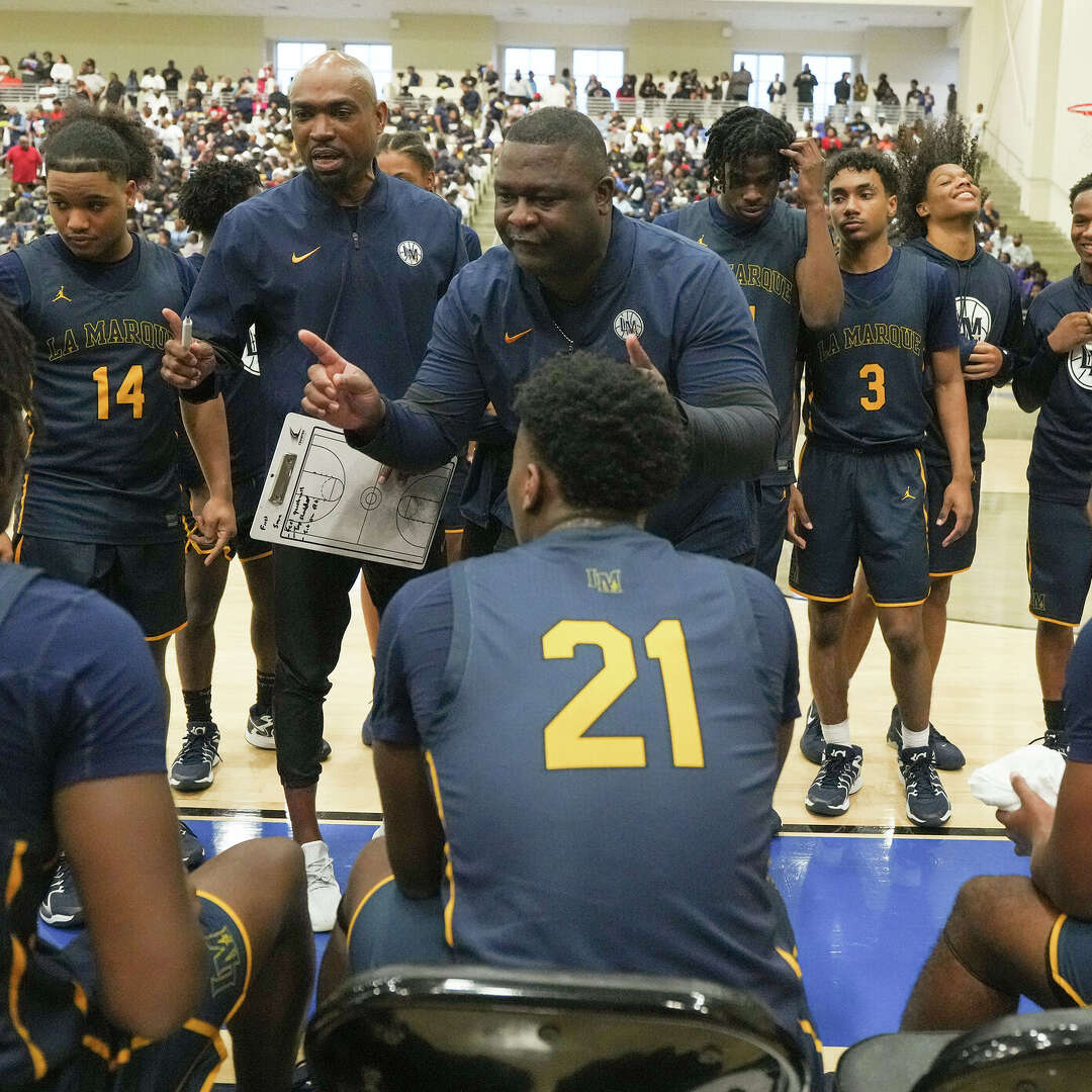 La Marque's head coach Kevin Wilcox talks to his team between quarters during the boys high School Class 4A Division II state semifinals against Wheatley at Hopson Fieldhouse in Missouri City on Tuesday, March 10, 2026. La Marque won the game 68-67.