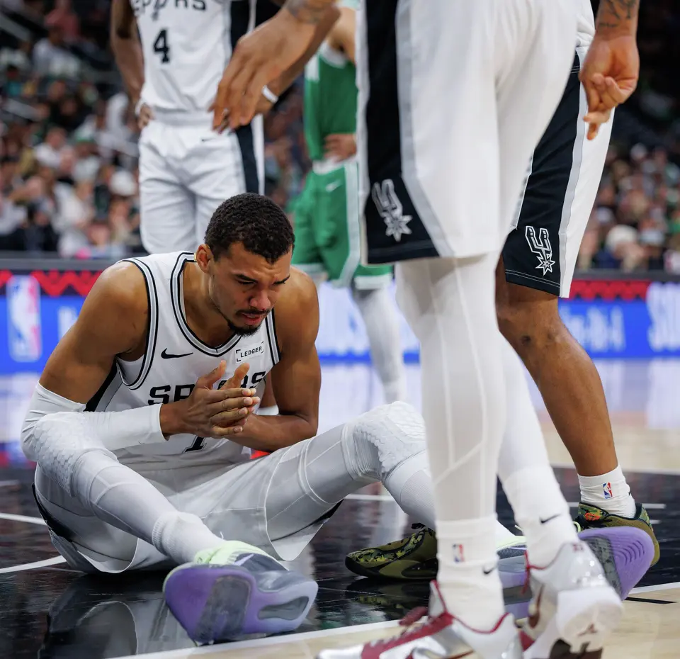 Blood drips off of San Antonio Spurs forward Victor Wembanyama’s nose after colliding with Boston Celtics forward Sam Hauser (30) while driving to the net during the first quarter at Frost Bank Center in San Antonio, Tuesday, March 10, 2026. The Spurs defeated the Celtics 125-116.