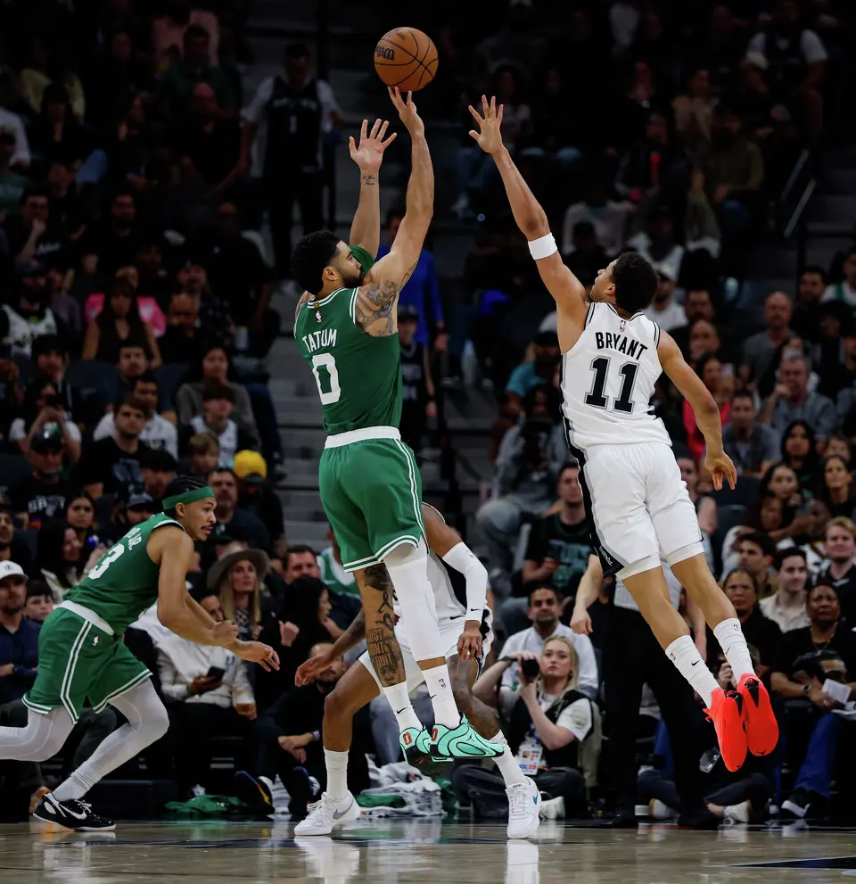 Boston Celtics forward Jayson Tatum (0) shoots over San Antonio Spurs forward Carter Bryant (11) during the second quarter at Frost Bank Center in San Antonio, Tuesday, March 10, 2026.