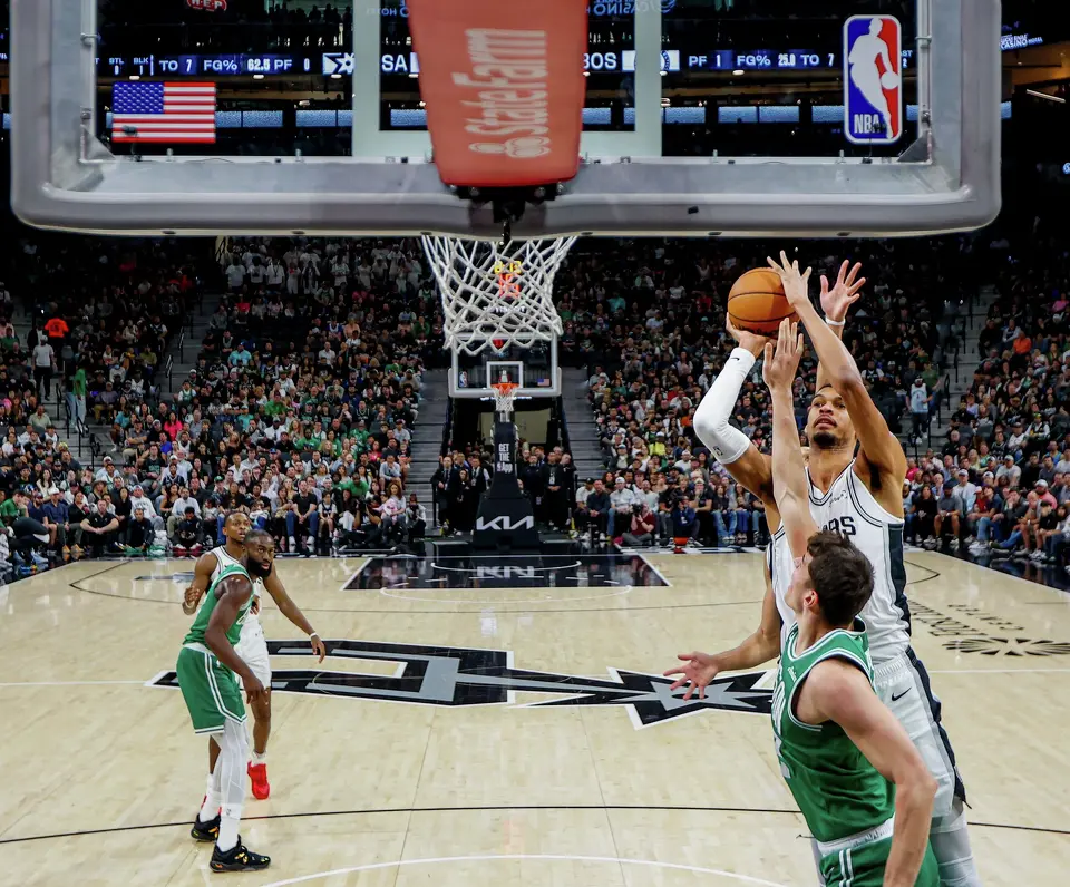 San Antonio Spurs forward Victor Wembanyama (1) shoots over Boston Celtics center Luka Garza (52) during the first quarter at Frost Bank Center in San Antonio, Tuesday, March 10, 2026. The Spurs defeated the Celtics 125-116.