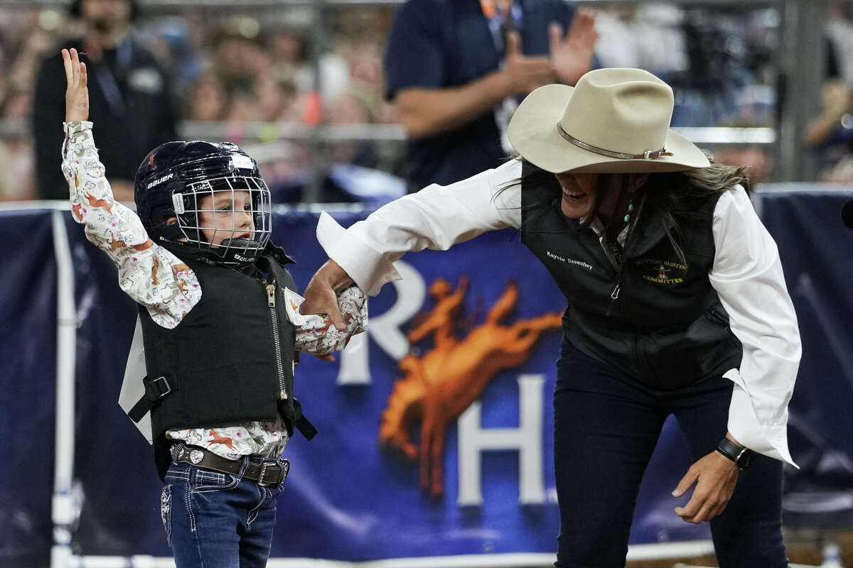Emerson Leonard reacts after riding her sheep all the way to the back of the arena during mutton bustin' at the Houston Livestock Show and Rodeo, Tuesday, March 10, 2026, in Houston.