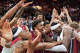 Rekan satu tim Heat merayakan center Bam Adebayo, kanan, setelah ia mencetak 83 poin, total pertandingan tunggal tertinggi kedua dalam sejarah NBA, pada hari Selasa melawan Washington Wizards di Miami.