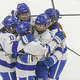 Darien's Teagan Josef (12) celebrates her goal with teammates during their 6-1 win over Hall/Conard in the CHSGHA state championship game Wednesday, March 11, 2026 at M&T Bank Arena in Hamden.