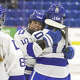Darien's Lila Fiorita (14) is congratulated by teammate Adriana Gromelski (10) after scoring a goal during their 6-1 win over Hall/Conard to capture the CHSGHA state championship title Wednesday, March 11, 2026 at M&T Bank Arena in Hamden.