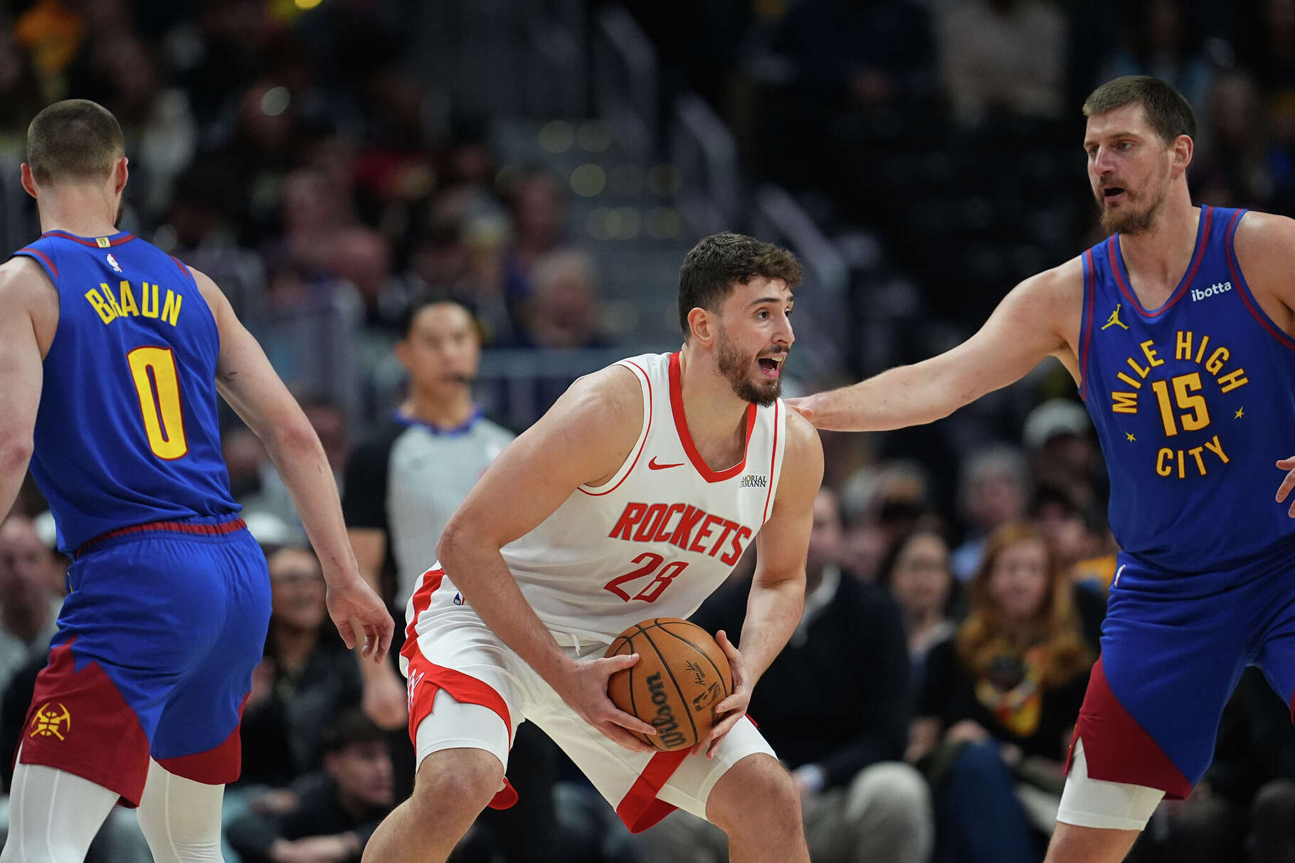 Center Alperen Şengün and the Rockets saw things promptly go south in the second half as center, looks to pass the ball as the Nuggets rolled to a blowout win Wednesday in Denver.