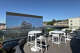 Views of movie screens and the Hollywood Hills from the rooftop deck at the Tesla Diner in West Hollywood, Calif.