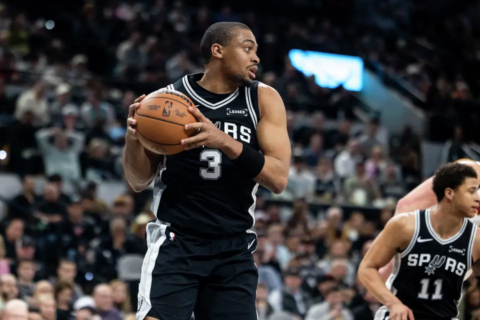 San Antonio Spurs forward Keldon Johnson (3) rebounds the ball at Frost Bank Center in San Antonio on Thursday, March 12, 2026.