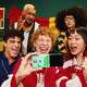 Sports fan friends taking a selfie with a Motorola razr phone.