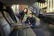 Takahiro and Hitomi Miyata look at a Tesla Cybercab on display at a pop-up event at Fareground Austin in downtown Austin during the South by Southwest Conference and Festivals.