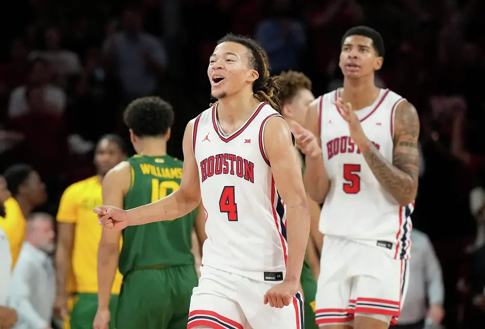 Houston guard Kingston Flemings (4) reacts during the second half of an NCAA college basketball game against Baylor, Wednesday March 4, 2026, in Houston. (AP Photo/Karen Warren)