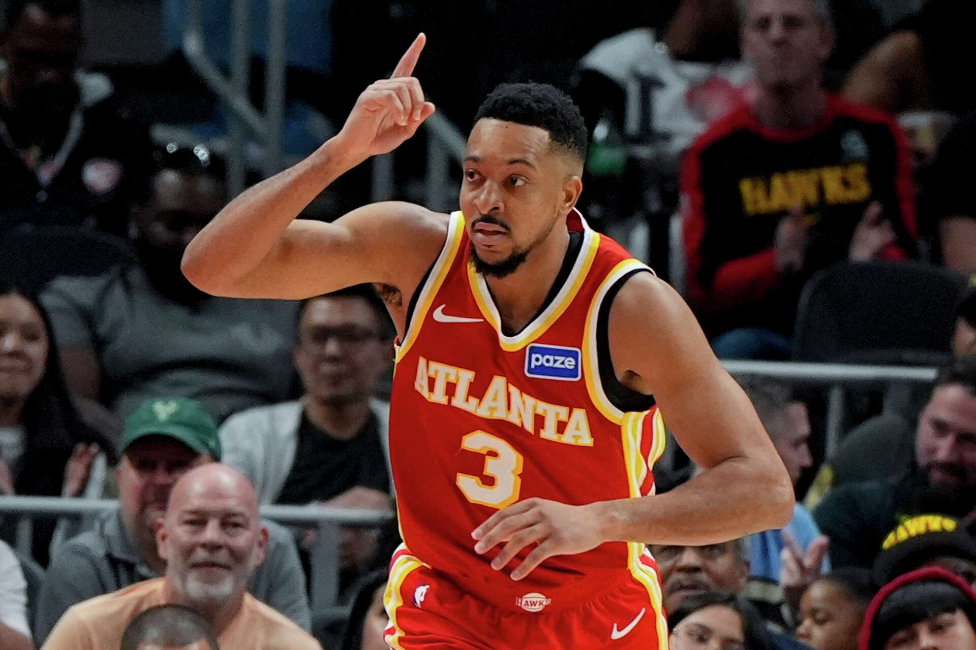McCollum scores 30, Johnson has a triple-double as the Hawks beat the Bucks  for 9th straight win