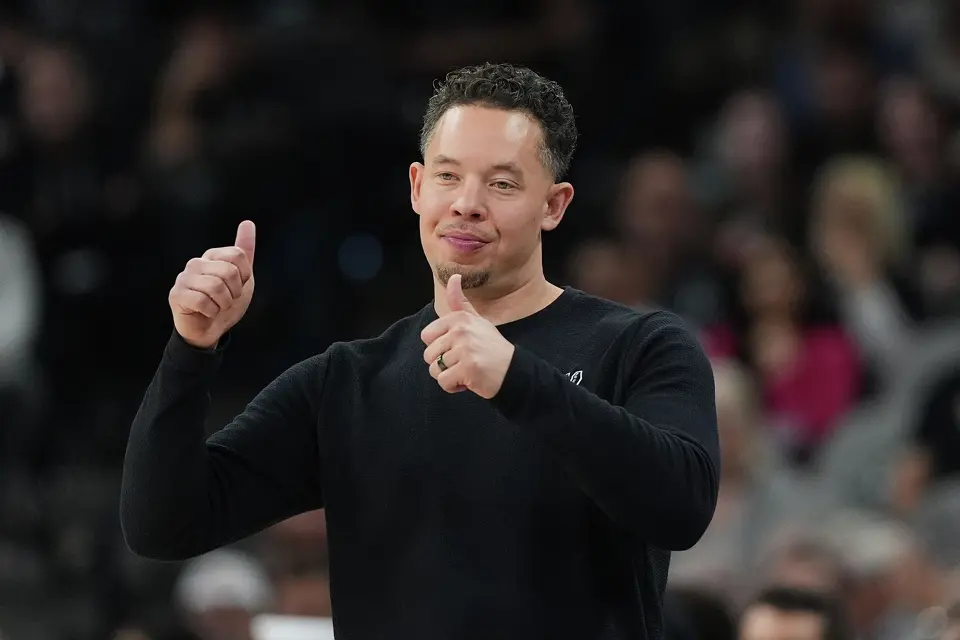 San Antonio Spurs head coach Mitch Johnson signals to his players during the second half of an NBA basketball game against the Charlotte Hornets in San Antonio, Saturday, March 14, 2026. (AP Photo/Eric Gay)