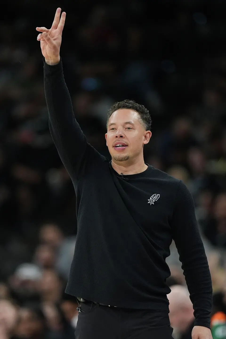 San Antonio Spurs head coach Mitch Johnson signals to his players during the second half of an NBA basketball game against the Charlotte Hornets in San Antonio, Saturday, March 14, 2026. (AP Photo/Eric Gay)