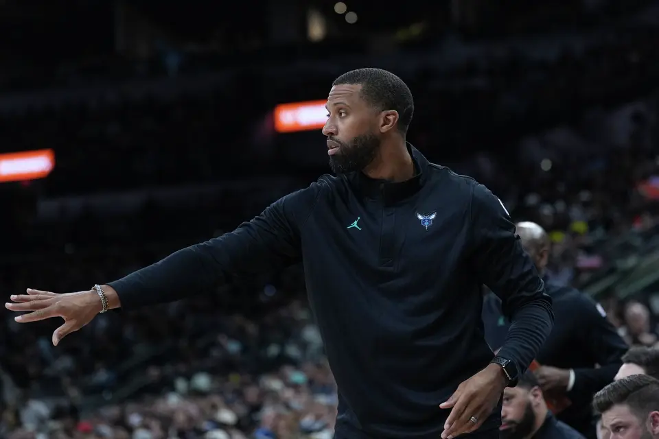 Charlotte Hornets head coach Charles Lee signals to his players during the first half of an NBA basketball game against the San Antonio Spurs in San Antonio, Saturday, March 14, 2026. (AP Photo/Eric Gay)