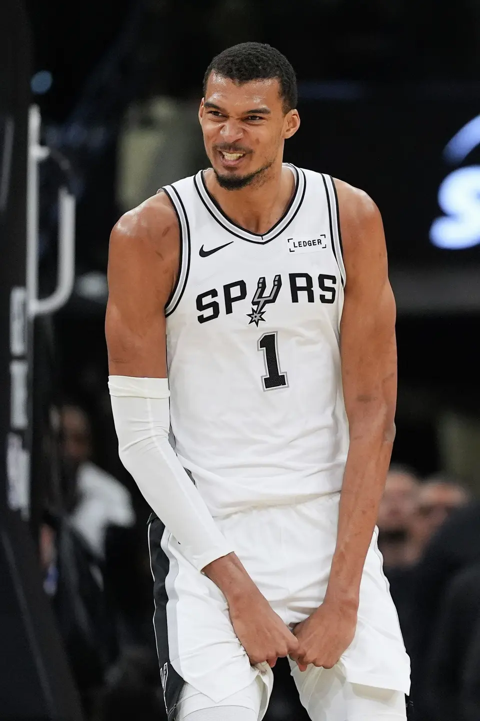 San Antonio Spurs forward Victor Wembanyama (1) reacts after scoring against the Charlotte Hornets during the second half of an NBA basketball game in San Antonio, Saturday, March 14, 2026. (AP Photo/Eric Gay)