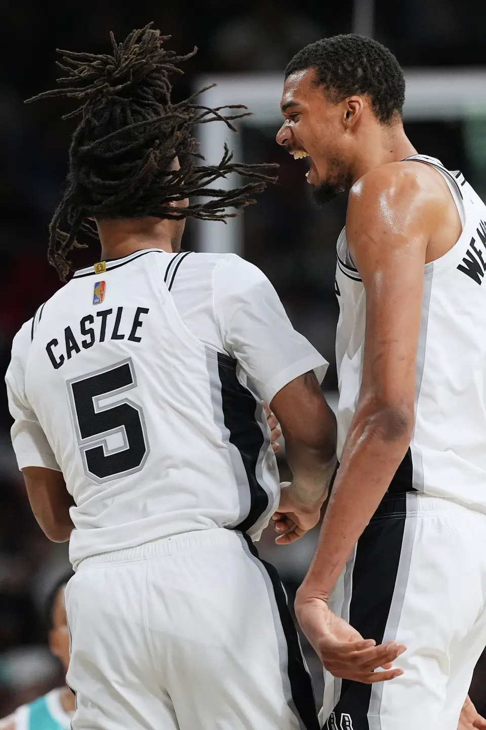 San Antonio Spurs forward Victor Wembanyama (1) celebrates a score with teammate Stephon Castle (5) during the second half of an NBA basketball game against the Charlotte Hornets in San Antonio, Saturday, March 14, 2026. (AP Photo/Eric Gay)