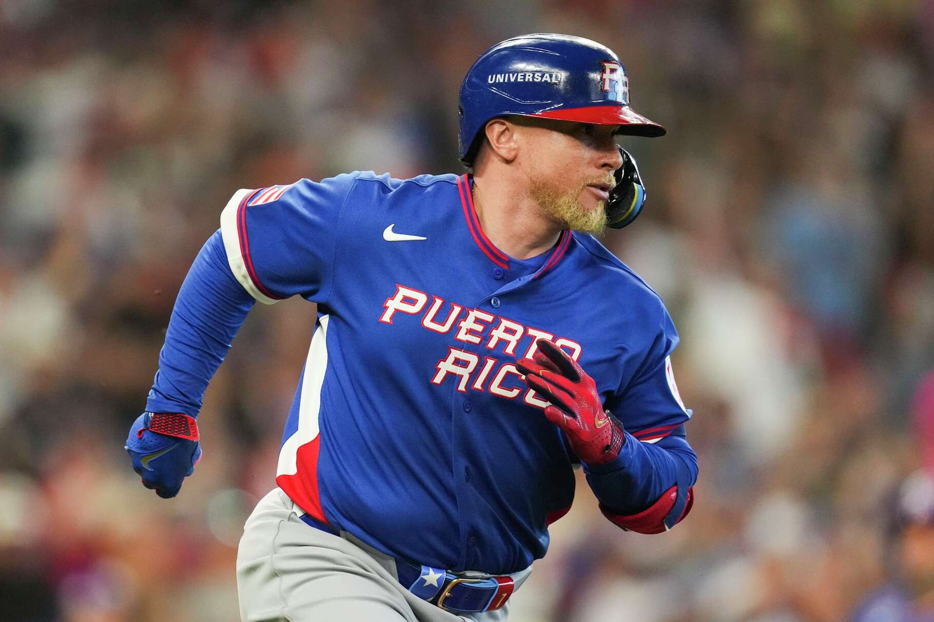 Puerto Rico's Christian Vázquez hits an 2-RBI single during the eighth inning of a World Baseball Classic quarterfinal game, Saturday, March 14, 2026, in Houston.