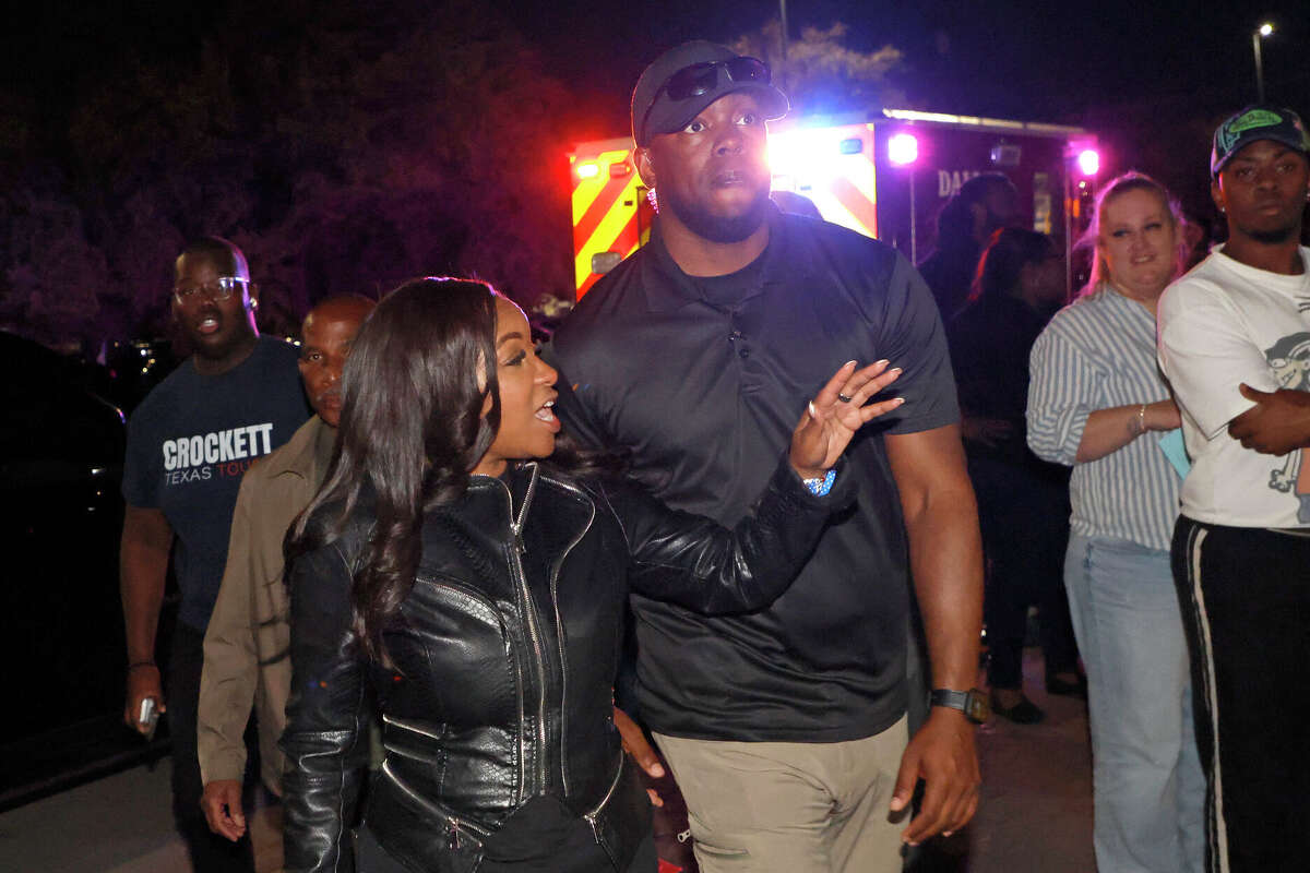 Rep. Jasmine Crockett (D-TX) with security guard known as Mike King and later identified as 39-year-old Diamon-Mazairre Robinson, arrives to greet supporters on February 27, 2026 in Dallas, Texas. Robinson was shot and killed in a standoff with Dallas police on March 11, 2026. (Photo by Ron Jenkins/Getty Images)